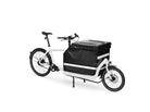 A white eBullitt cargo bike with a lidded black cargo box mounted on the cargo bed.