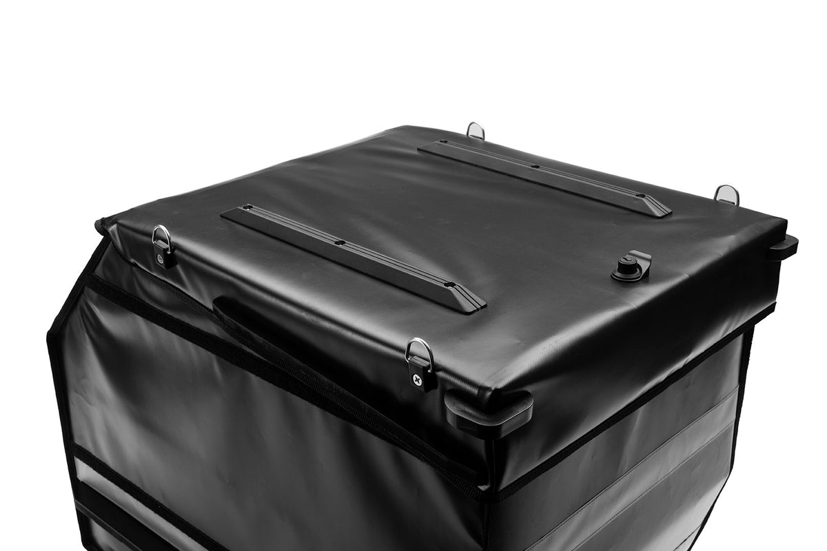 Black BagPRO box for Bullitt cargo bikes, with the lid closed. On the top of the lid you can see anchoring points for attaching extra cargo and plastic bumpers to protect the lid and the integrated lock.