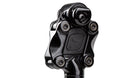 Closeup of a suspension seatpost head on a white background. The elastomer has an indent of a small gekko.