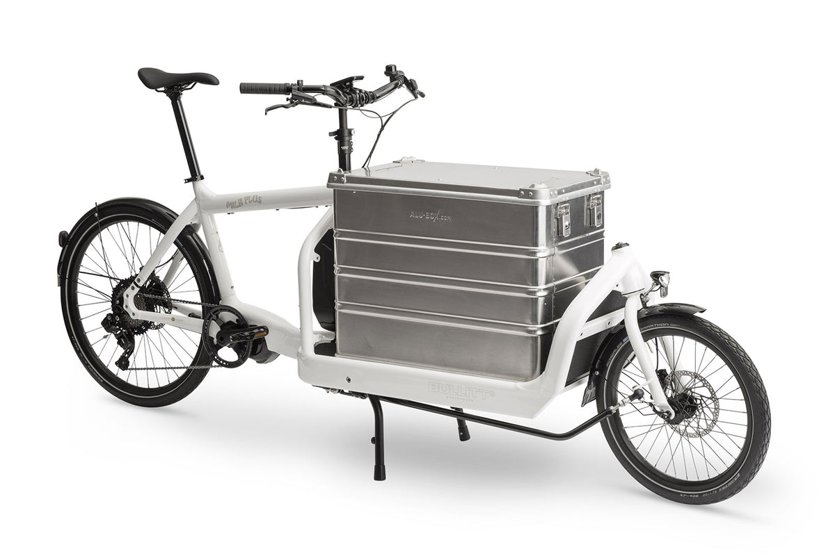 A white eBullitt cargo bike with a lidded aluminium transport box mounted on the cargo bed