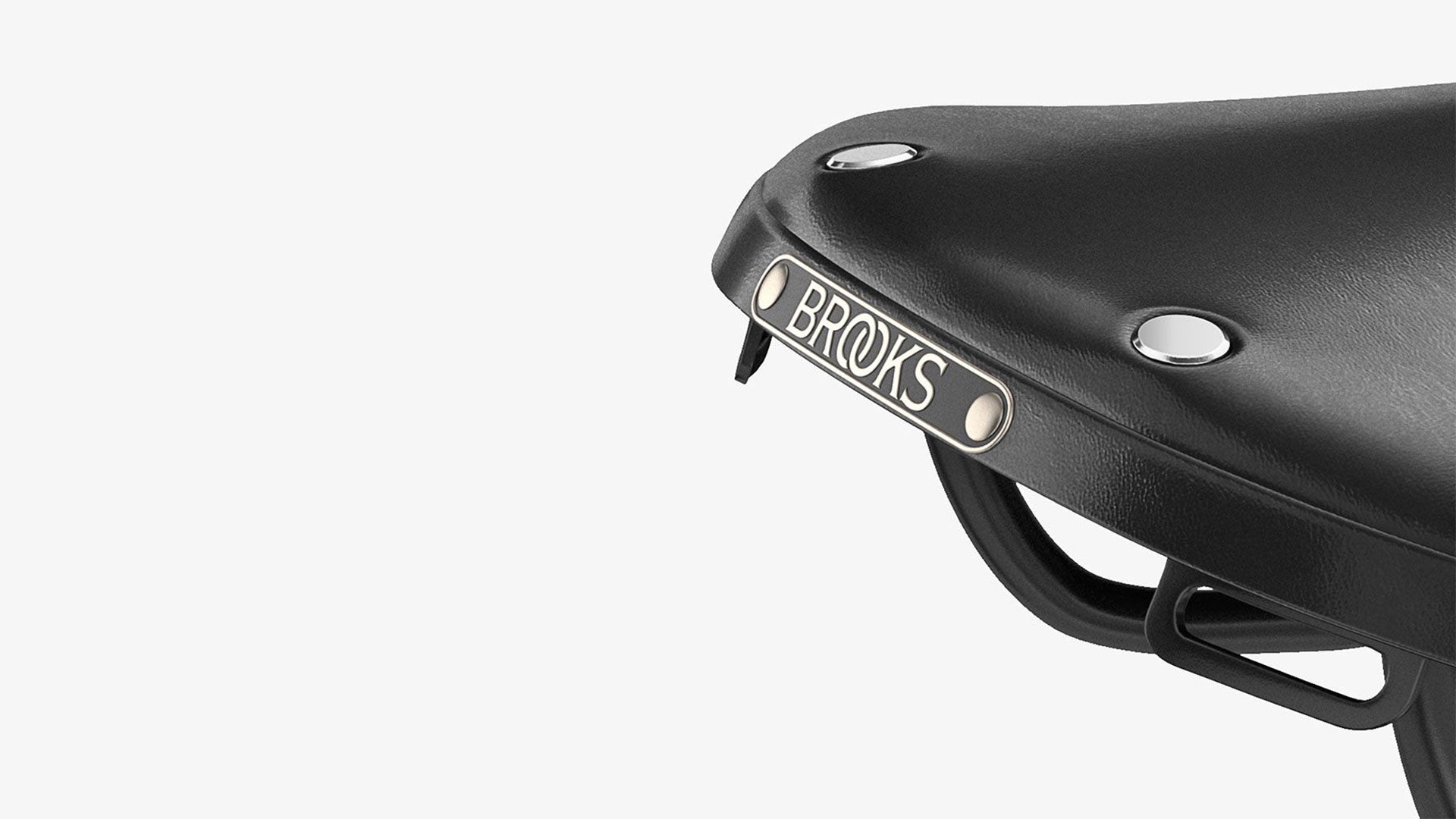 Closeup of Brooks label on B17 black saddle seen from the back on a white background
