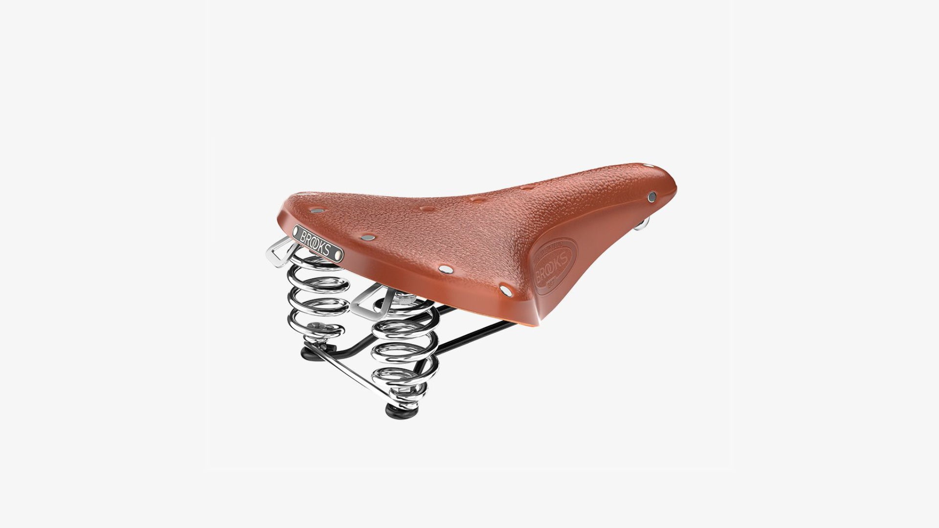 Brooks B67 honey saddle seen from an angle on a white background