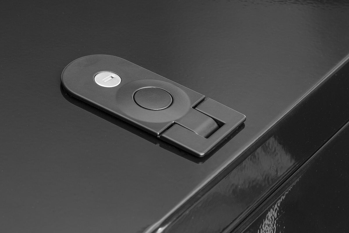 Closeup of the lock in the lid of a black convoy cargo box