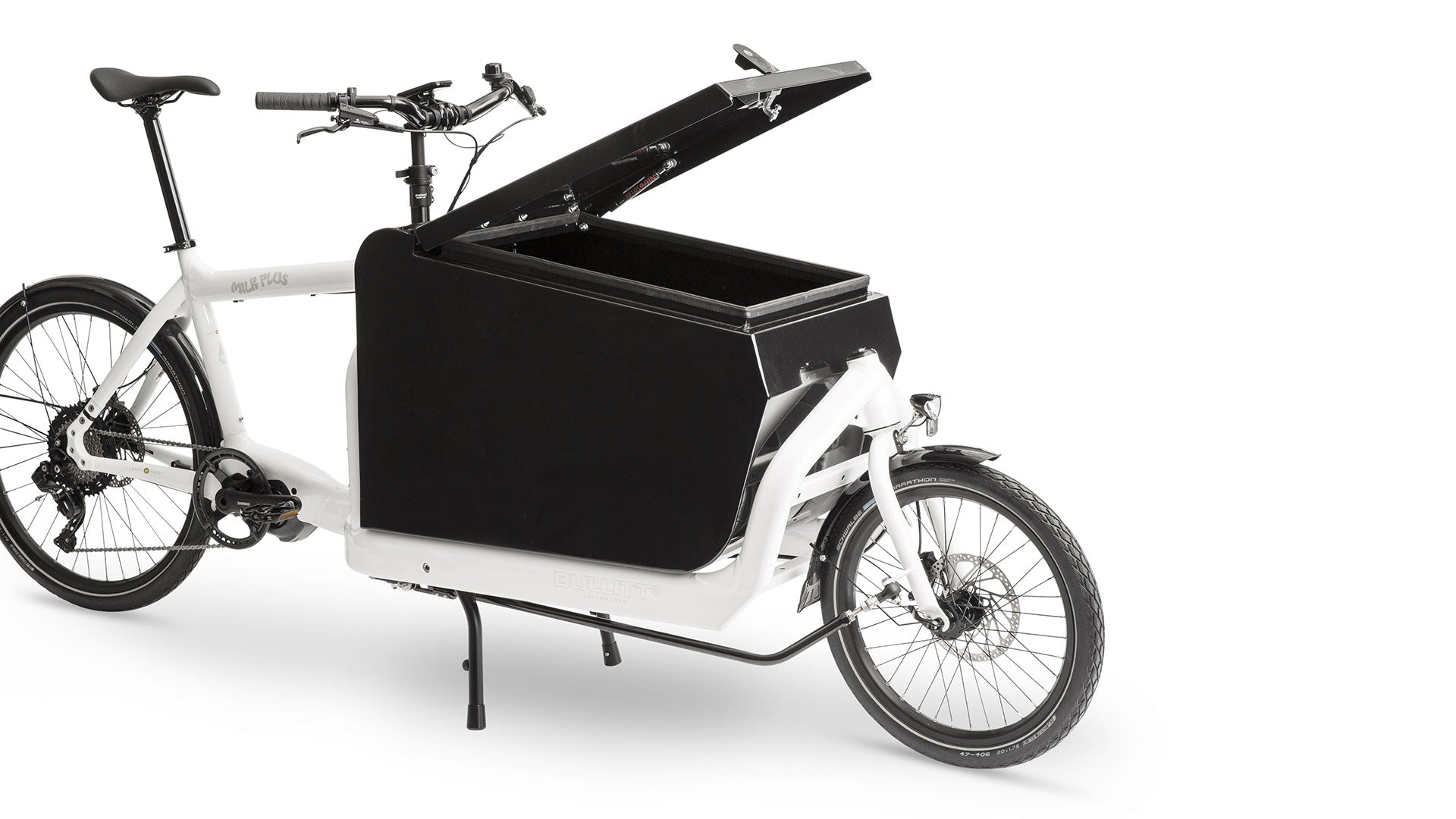A white eBullitt cargo bike with a lidded black aluminium cargo box mounted on the cargo bed. The lid is open, with a hydraulic arm and the locking mechanism visible.