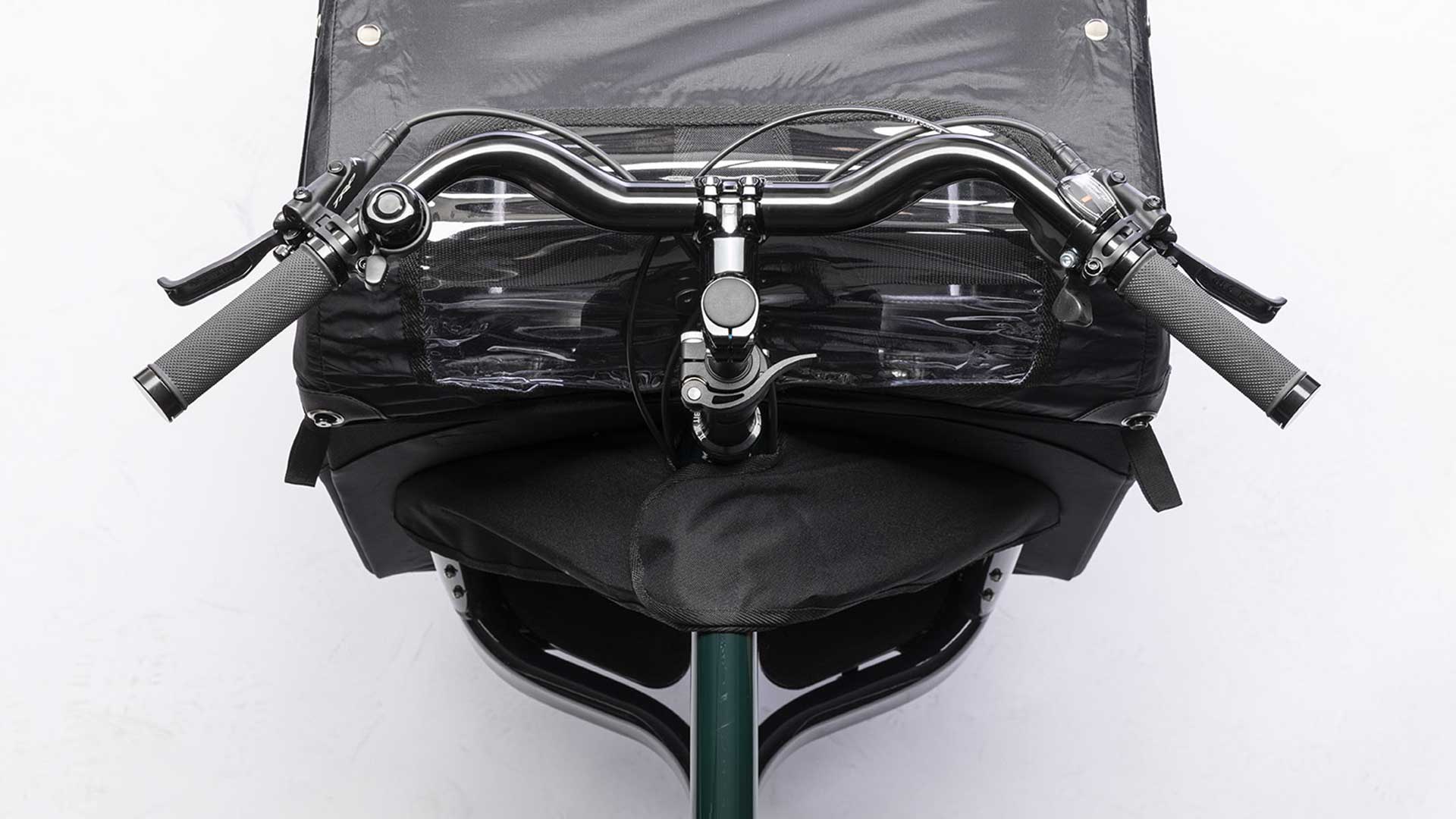 Closeup of the handlebar on a dark green Bullitt cargo bike, seen from above.
