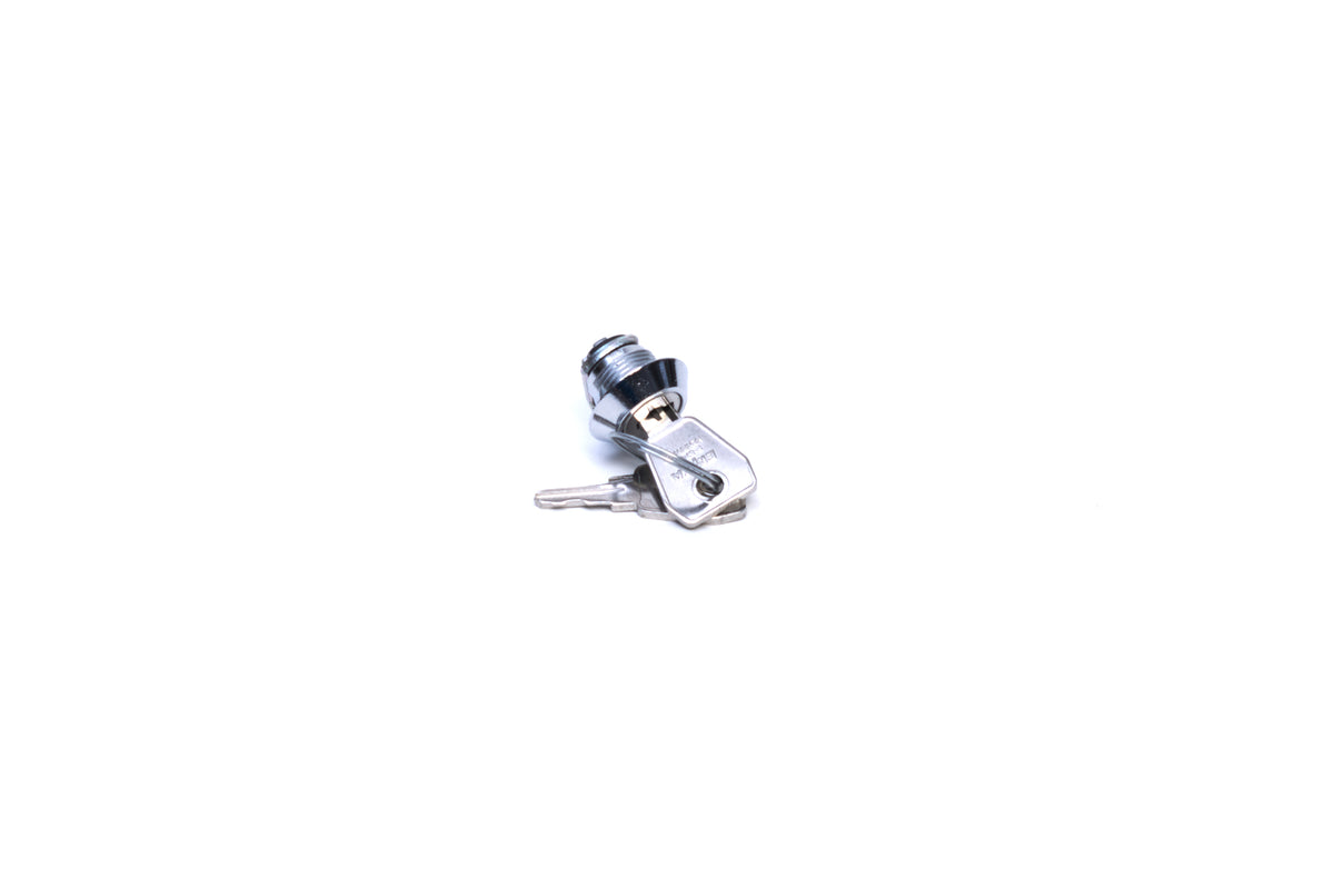 A lock cylinder with a key on white background