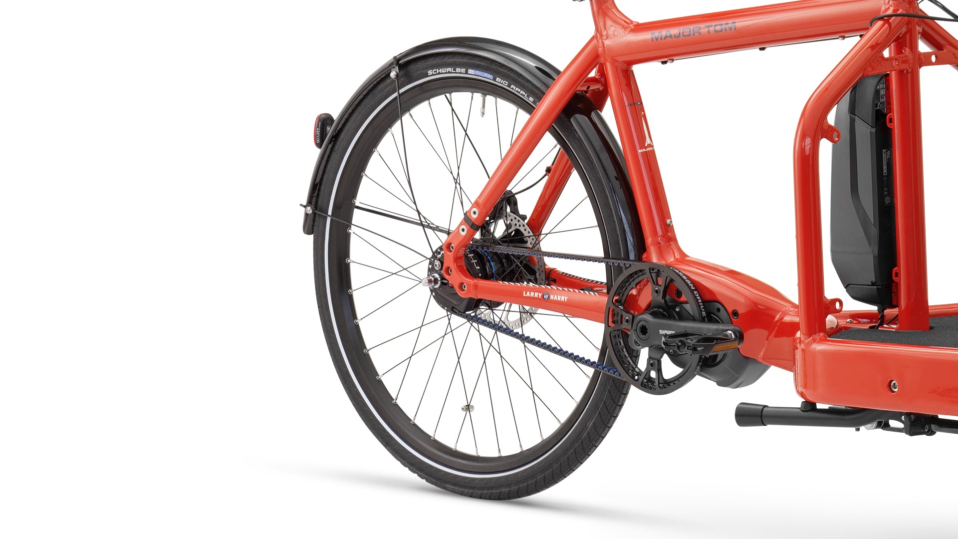 Closeup of a red Bullitt cargo bike, reart wheel mounted with a Schwalbe Big Apple tyre.