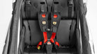 Closeup of the Larry vs Harry twin seat for Bullitt cargo bikes, with one 5 point harness seatbelt placed in the middle of the seat.