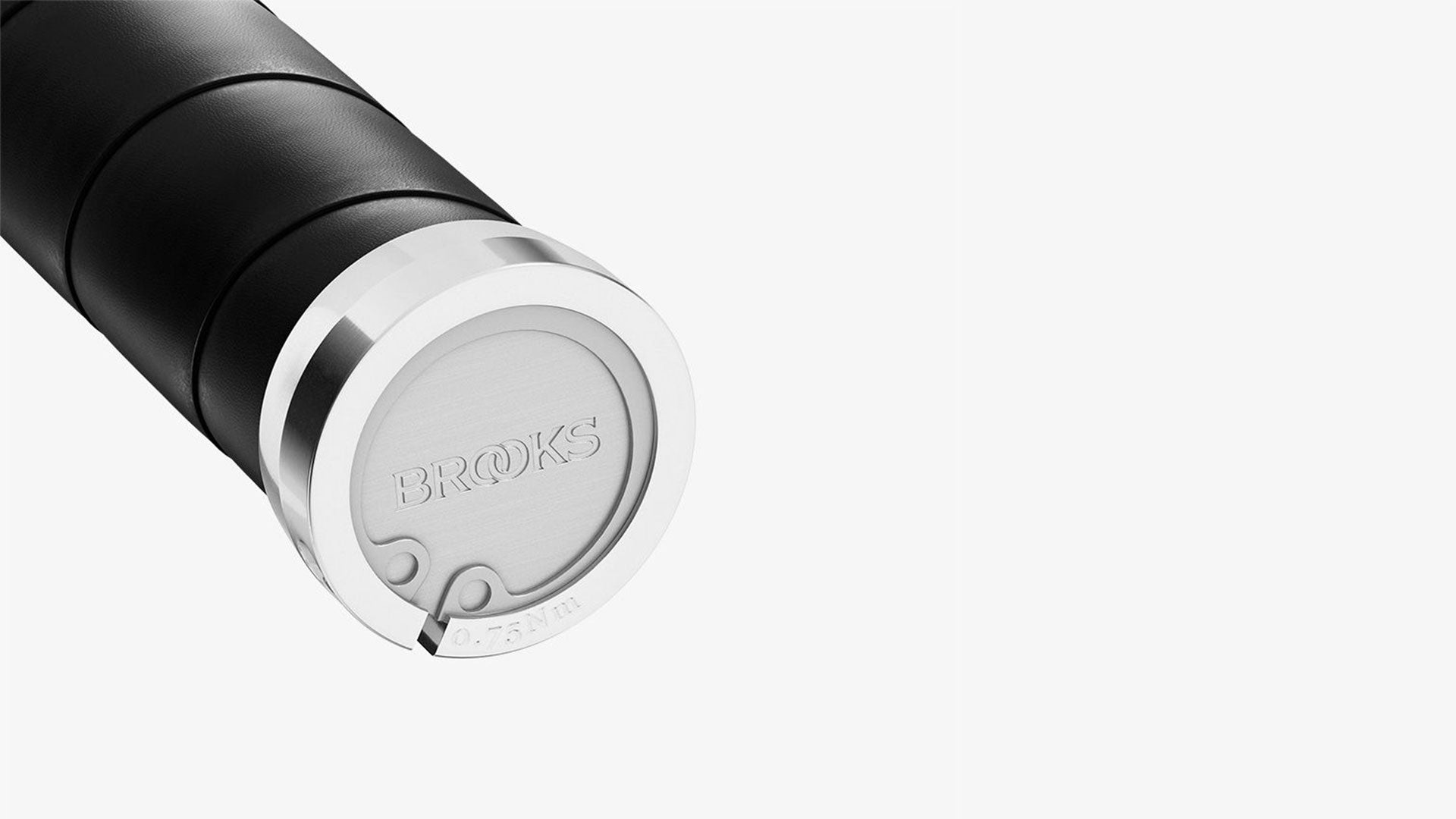 A black Brooks Slender grip on a white background