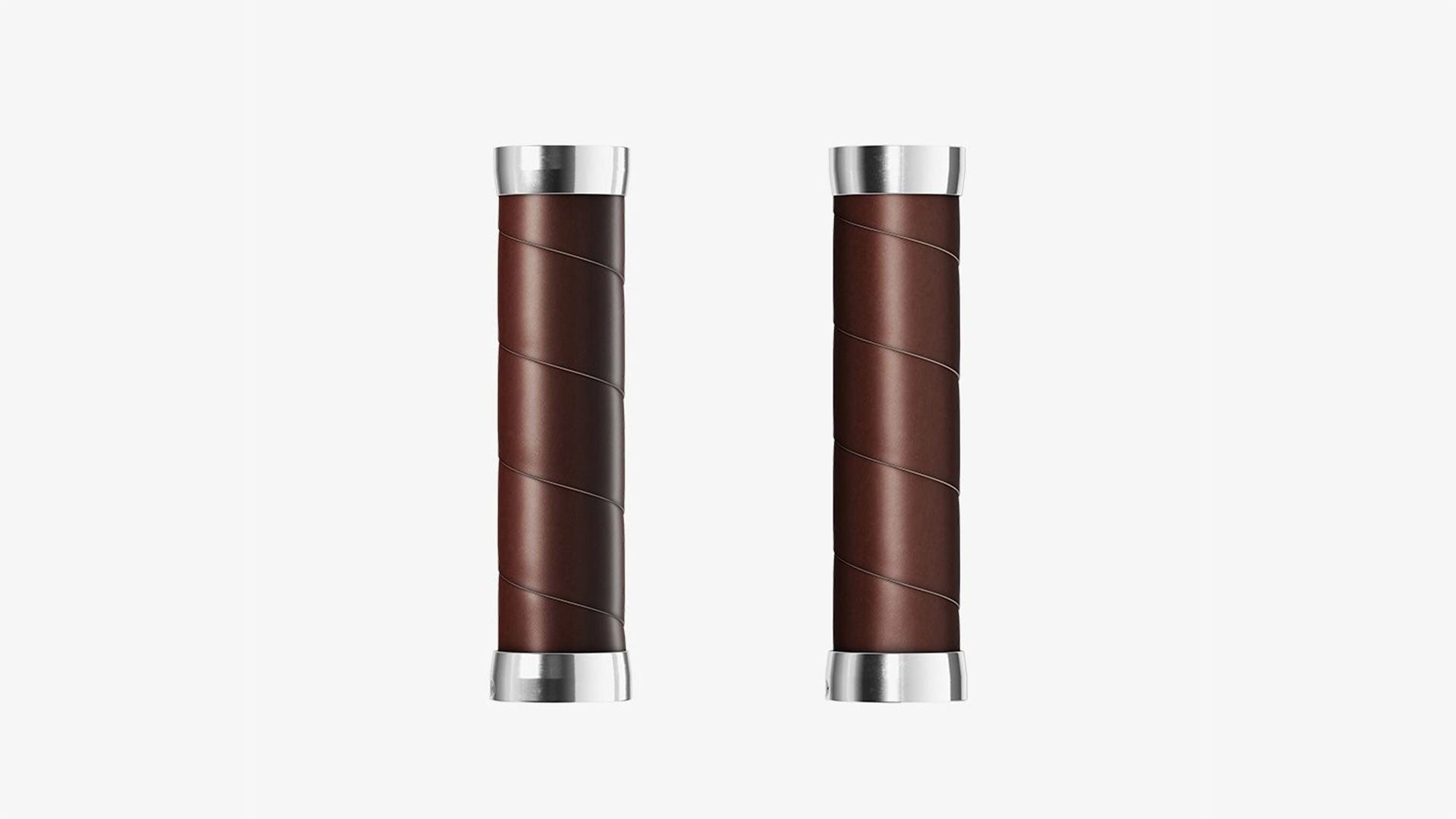 A pair of brown Brooks Slender grips on a white background