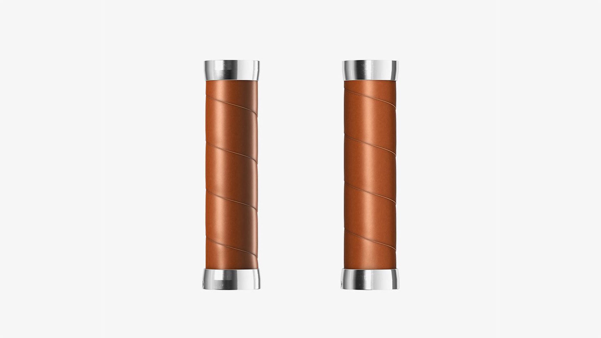 A pair of honey Brooks Slender grips on a white background