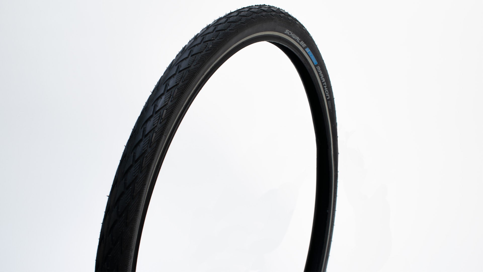 Closeup of a Schwalbe Marathon tyre on white background