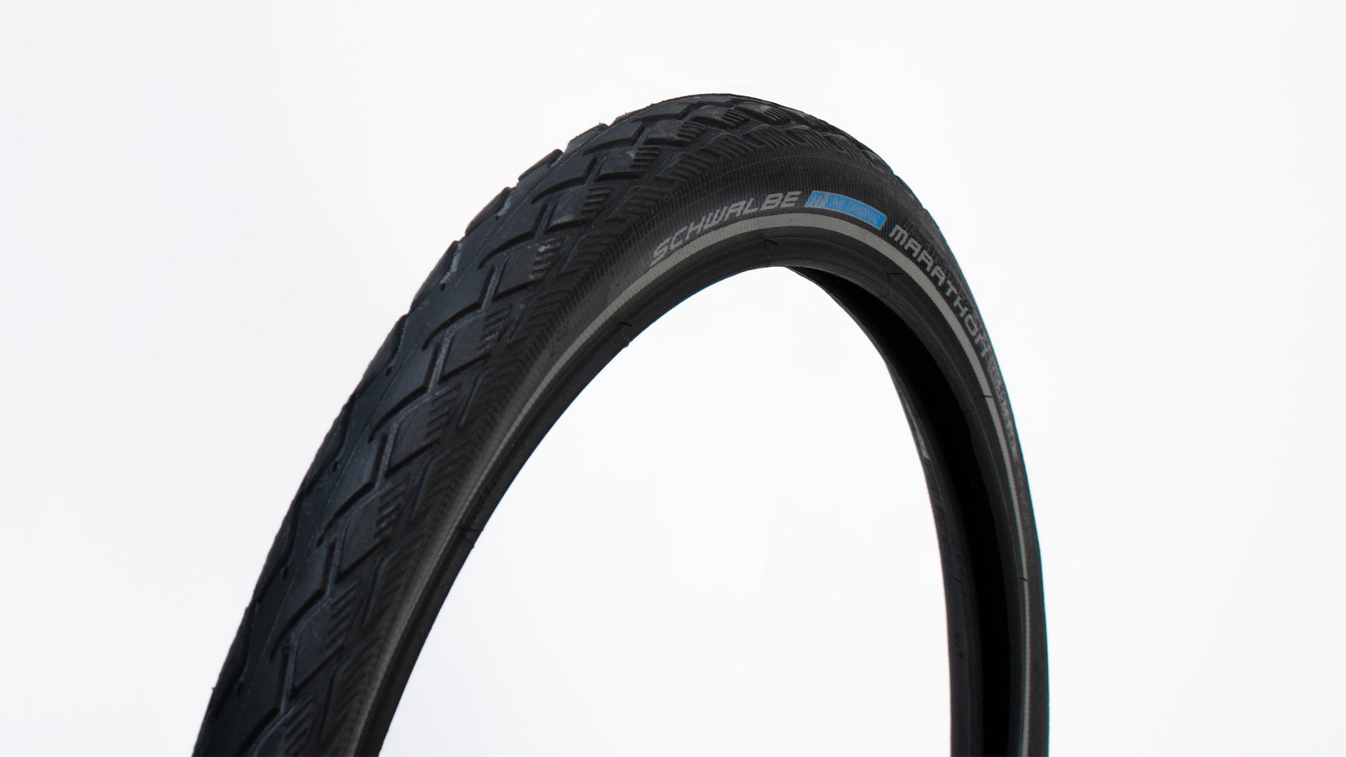Closeup of a Schwalbe Marathon tyre on white background