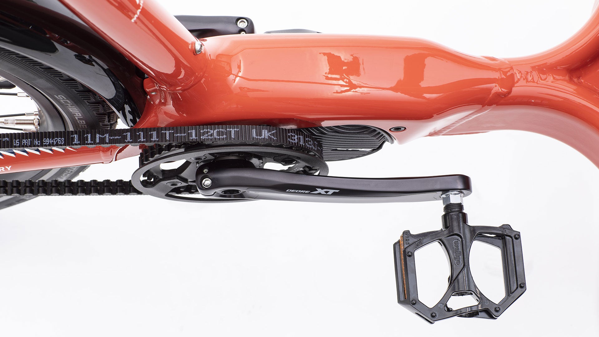 Closeup of the crank area of an eBullitt outfitted with Wellgo Platform pedals, Deore XT crankarms, Gates Carbon belt and EP8 drive unit.