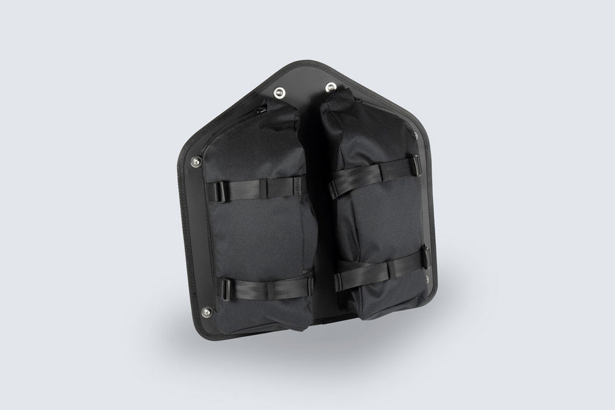 Font of Fahrer Panel Bags, showing two storage pockets with zippers and two webbing cinches on each pocket.