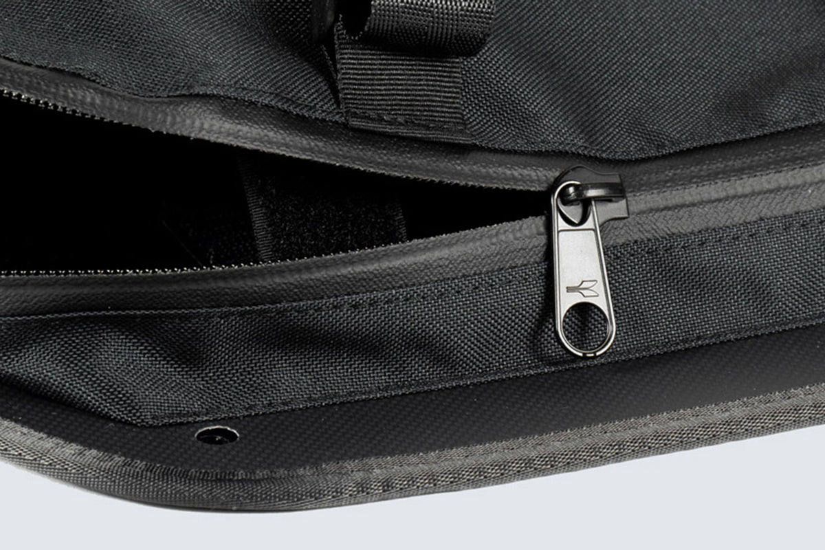 Close up of Fahrer Panel Bags showing a waterproof zipper, half open