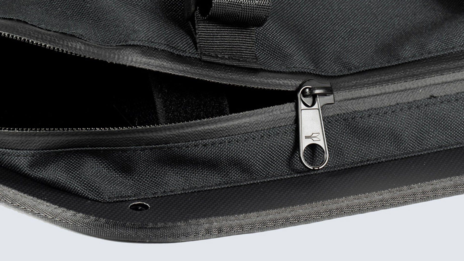 Close up of Fahrer Panel Bags showing a waterproof zipper, half open