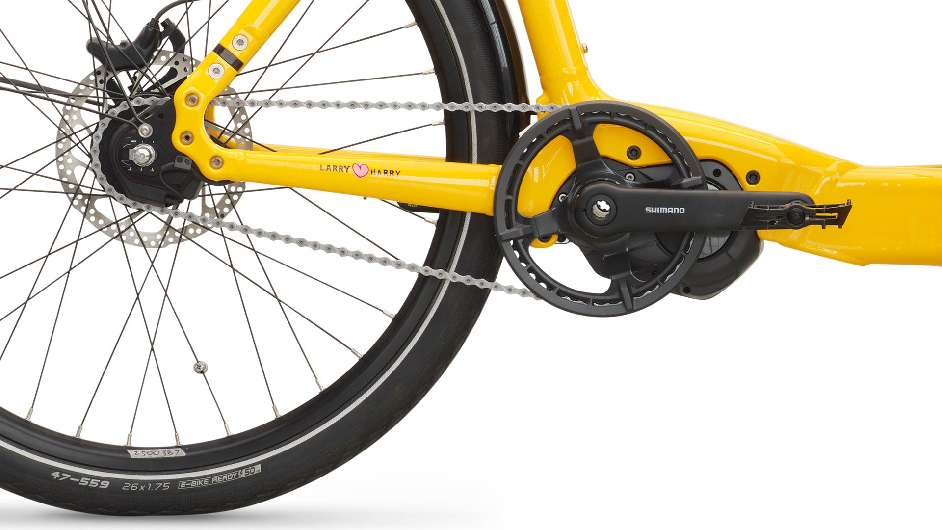 Close-up of a yellow Bullitt cargo bike chain and gear system on a white background
