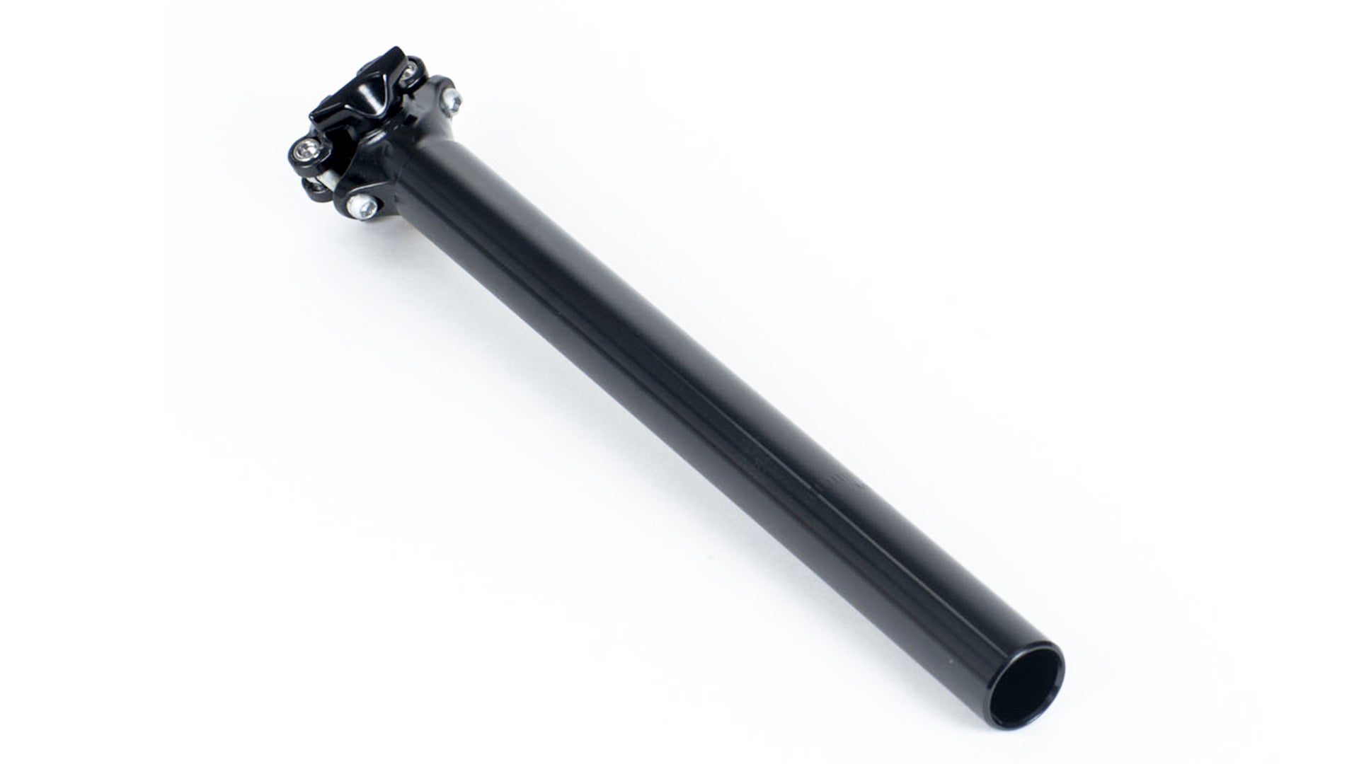 A black seatpost on a white surface