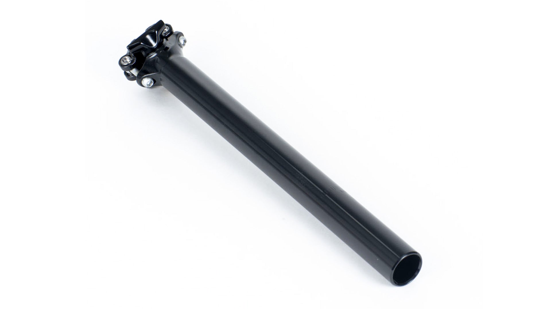 A long black seatpost on a white surface