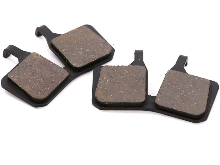 Two brakepads on a white background.