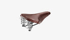 Brooks B67 brown saddle seen from an angle on a white background