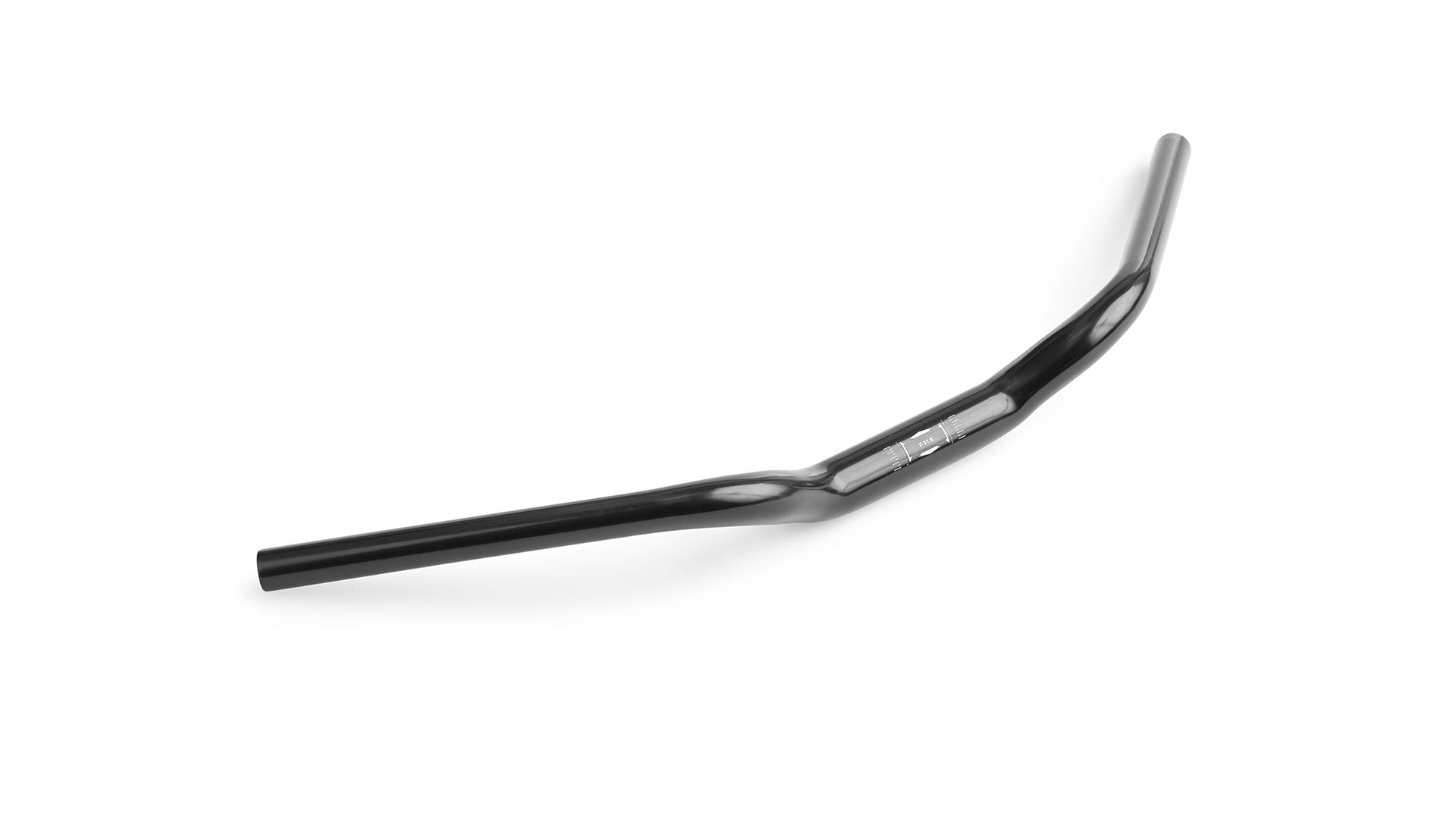 A black cruiser style handlebar lying on a white surface
