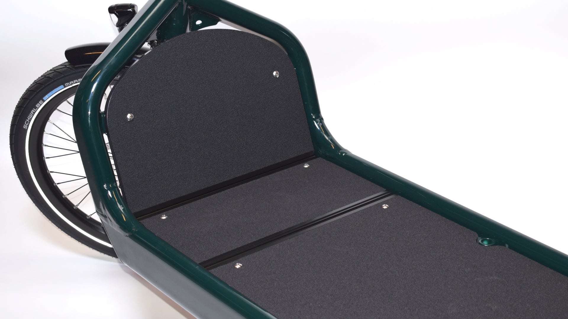 Closeup of a dark green Bullitt X cargo bike with the honeycomb board and extender mounted, on white background