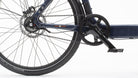 Closeup of the drivetrain on a pedal-powered Bullitt cargo bike with internal gears and Gates carbon belt