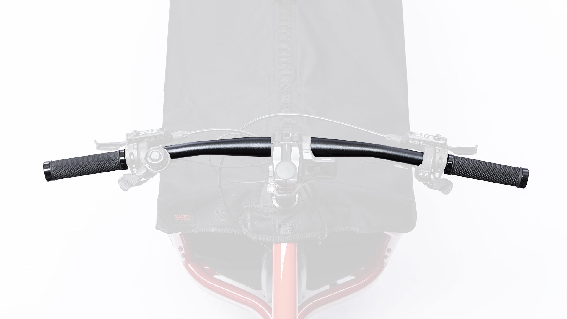 Closeup of the handlebar on a red eBullitt, seen from above.